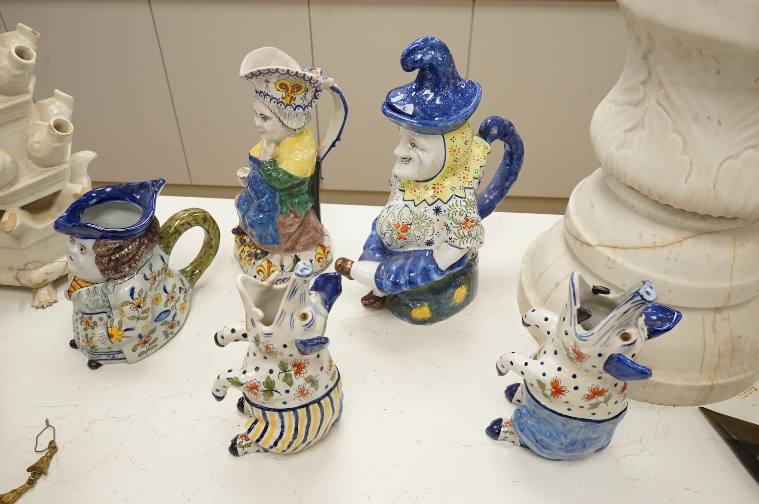 A group of five pieces of French tin glazed pottery, tallest 32cm